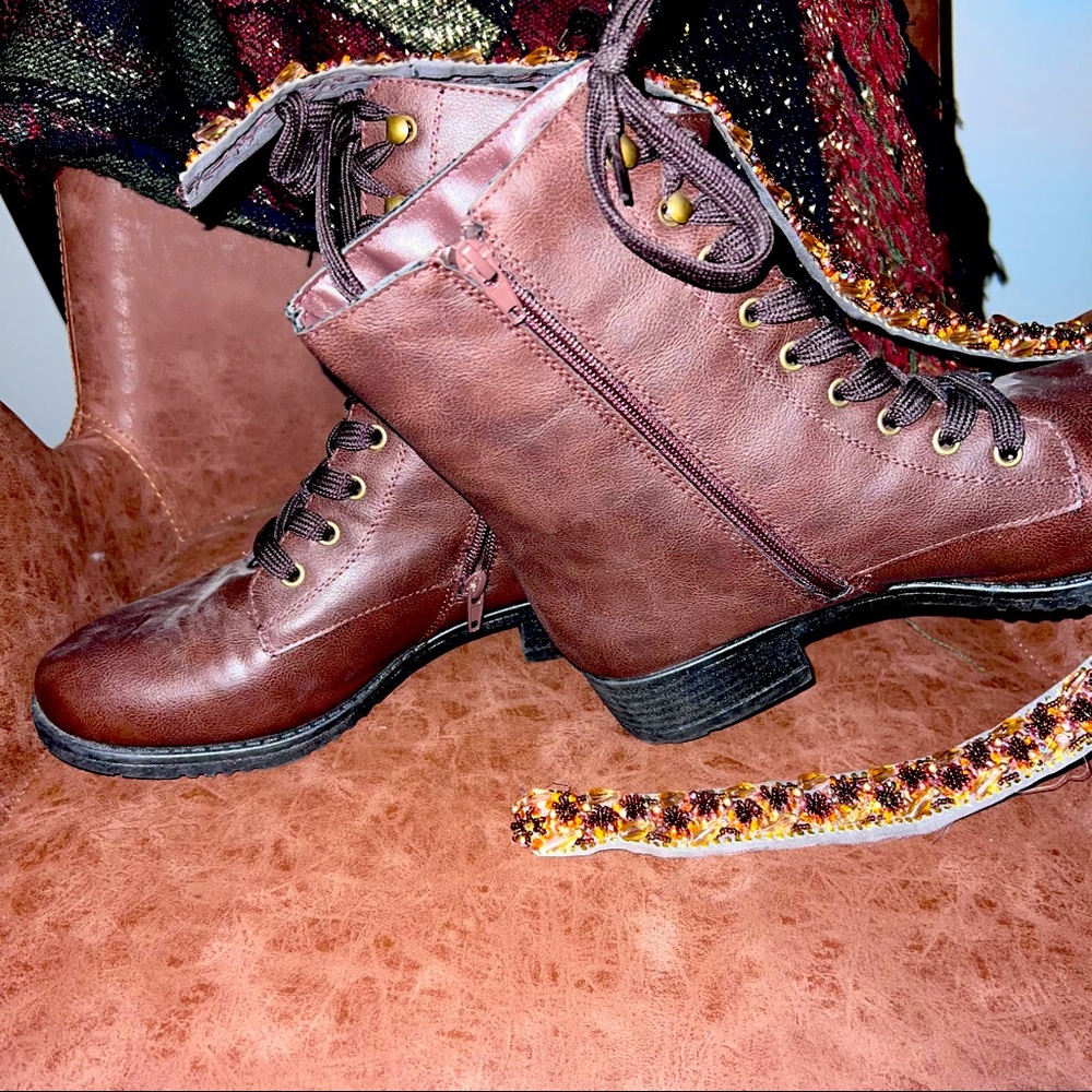 Brown lace up boots and ankle high. small heal inside zipper